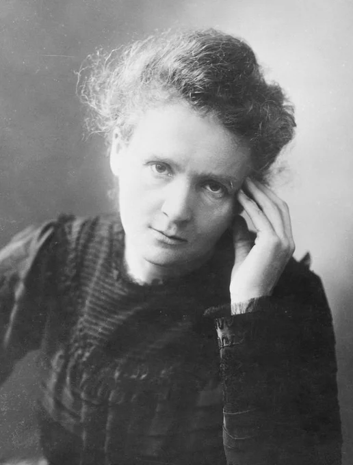 A black and white portrait of Marie Curie
