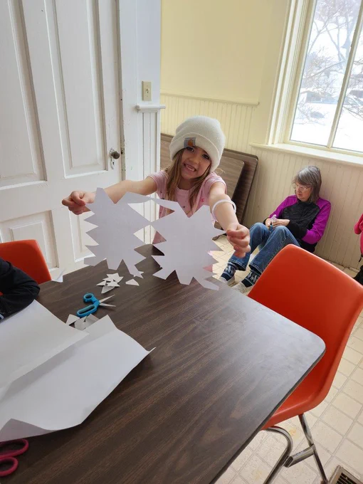 Making beautiful paper snowflakes...