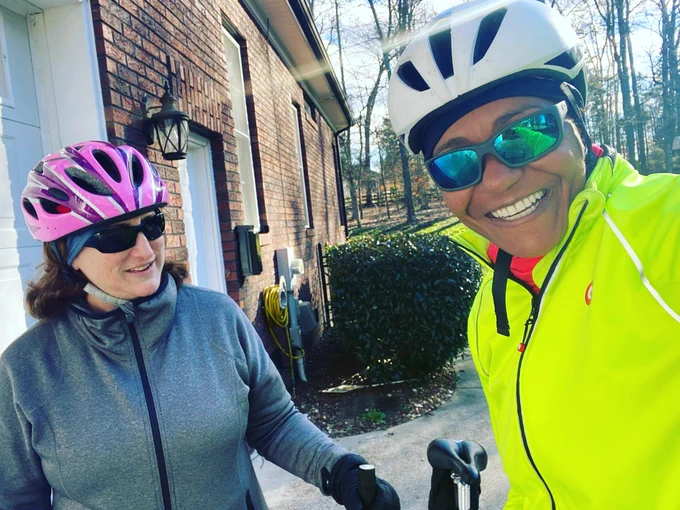 Jennifer and Janice are smiling and both are wearing helmets and bundled up for the cold