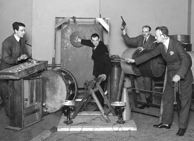The inventor of modern sfx, Alfred Whitman (r. with cigarette) at work at the BBC c. 1927. Copyright BBC Archive.