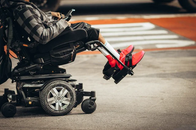 A youth who uses a power wheelchair.