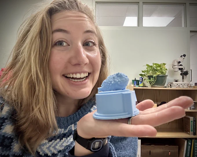Katherine Corn holding 3D printed lumpsucker trophy!