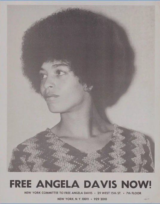 A poster showing a black-and-white head-and-shoulders portrait of Angela Davis, facing left. Black text below reads "FREE ANGELA DAVIS NOW!" Below reads "NEW YORK COMMITTEE TO FREE ANGELA DAVIS, 29 WEST 15TH ST, 7TH FLOOR, NEW YORK, NY 10011, 9292010. New York Committee to Free Angela Davis advertisement, ca. 1971. Accessed via the Library of Congress, Yankee poster collection. 