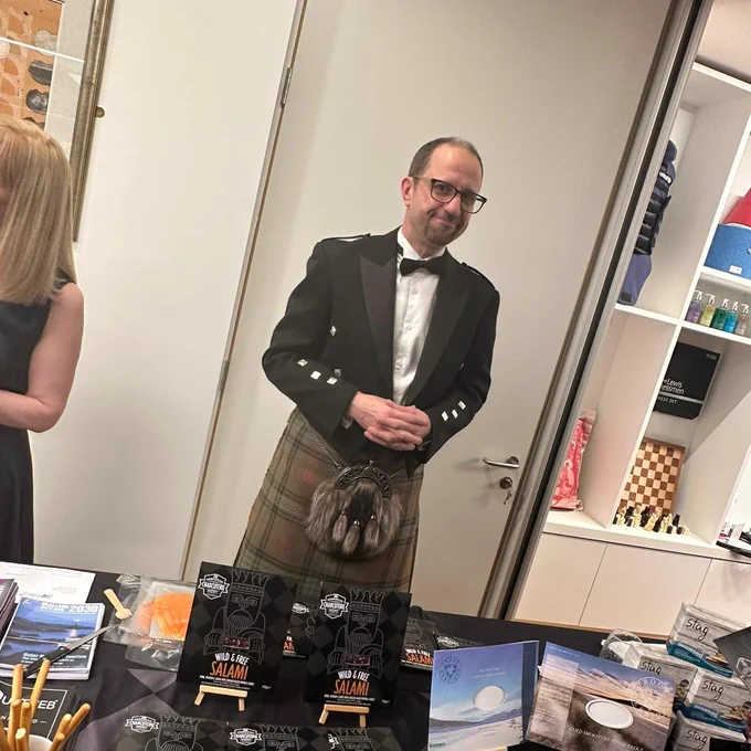 A photograph of a representative at a Hebridean Charcuterie showcase stand