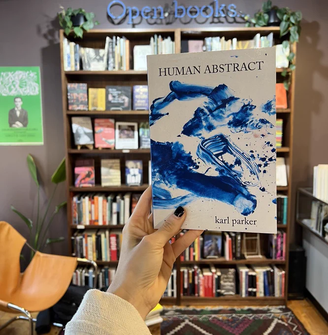 Hand holding book in store