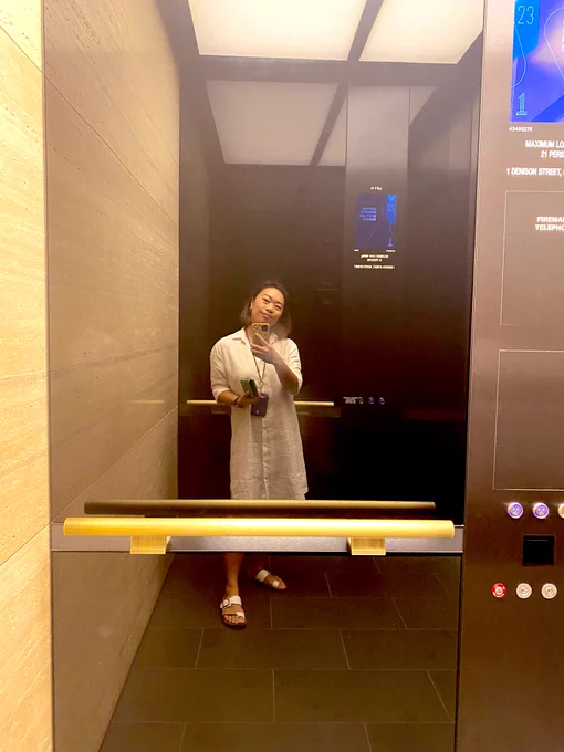 Anna takes a selfie in the elevator