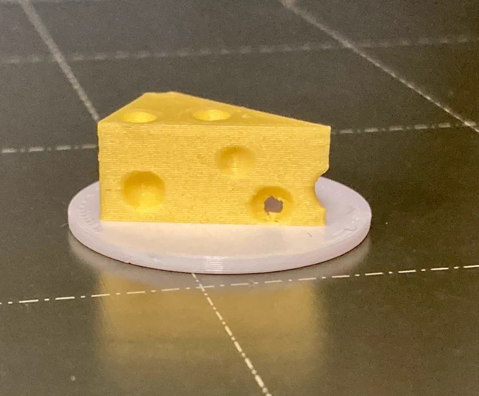 White plate with yellow cheese