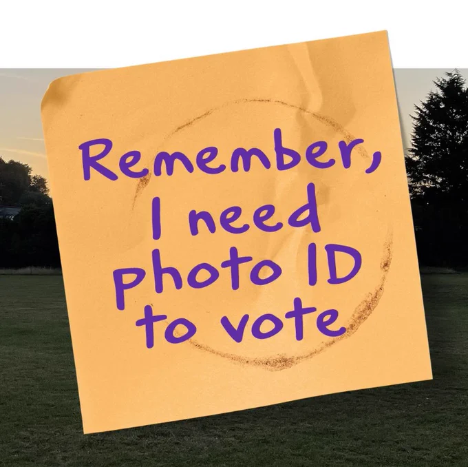 Orange post-it note with 'Remember, I need photo ID to vote' written on it