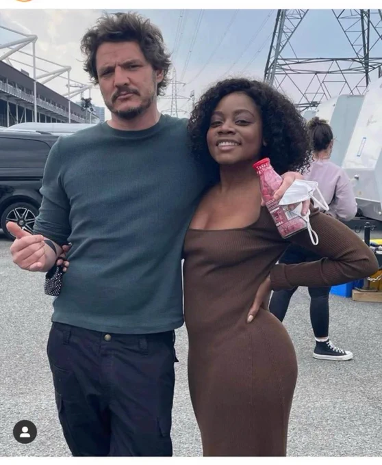 Actor Pedro Pascal holding a Treat Kitchen message bottle of vegan sweets 