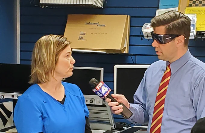 Alphapointe Occupational Therapy Assistant Becky Dumsky being interviewed by Fox4 Reporter Matt Stewart about Alphapointe's free low vision classes