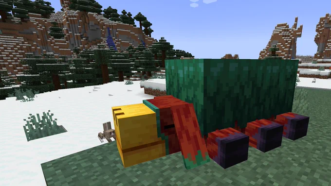 A sniffer lays down in a snowy biome