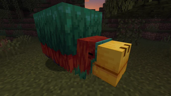 A sniffer stands in a grassy biome