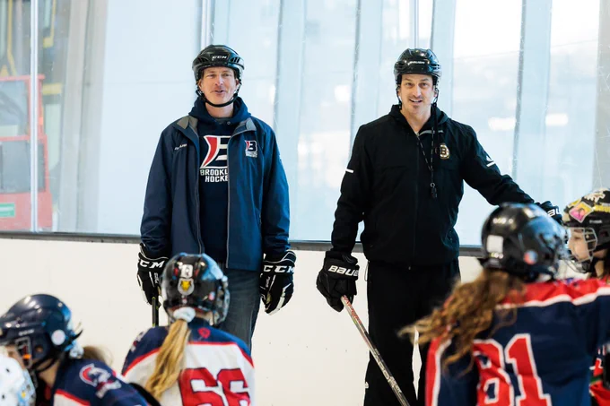 Brookline youth hockey coach Dave Charbanneau and Andrew Raycroft during a drill.