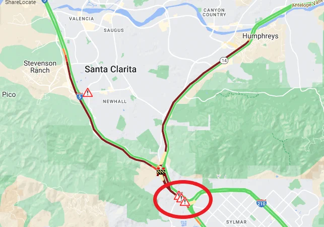 TRAFFIC ALERT: Overturned big rig carrying 75,000 pounds of dog food CLOSES SB I-5 connector to EB I-210, SB I-5 Truck Route to Route 14 and SB 14 Truck Route to SB I-5 in #Sylmar area. Dog food must be off-loaded. Expect delays. Unknown duration. #BeWorkZoneAlert. 