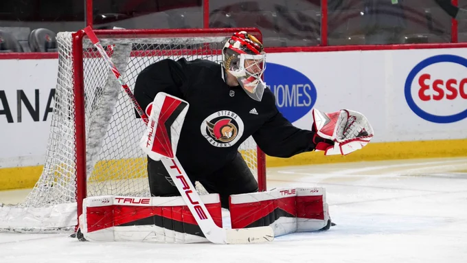 Mads Søgaard makes a reaching glove save during practice this morning at Canadian Tire Centre