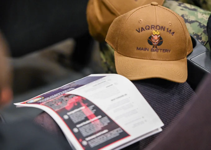 Image: USNCC flyer and EA-18G Growler squadron hat