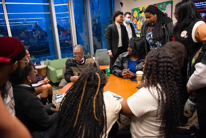Students meet with Bobby Seale in the Black/African American Cultural Center. 