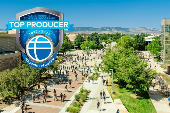 A view of CSU campus looking towards the west with blue skies and green trees. A Fulbright Program logo sits in the upper left hand corner.