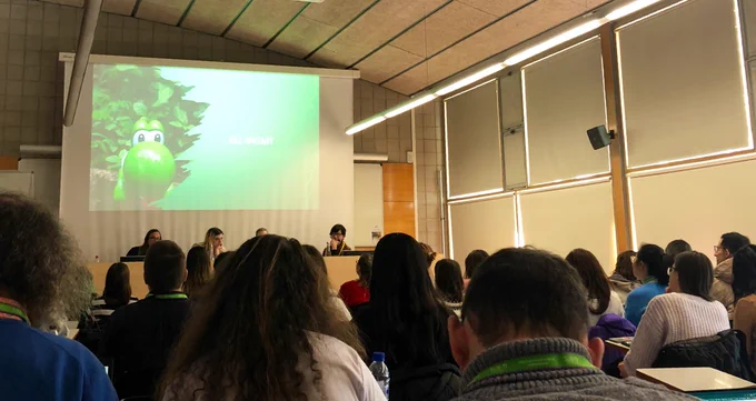 Presentation by María Isabel Rivas Ginel under the title "Non-binary language use in video games and players’ immersion, a study". There is around 70 people in the public, seated.