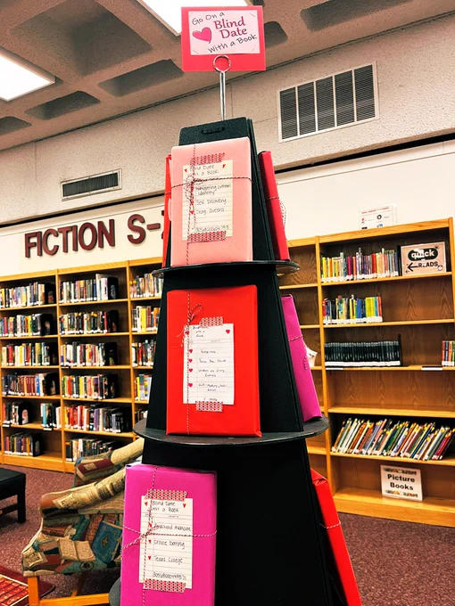 Blind Date with a Book pyramid display with brightly colored wrapped books