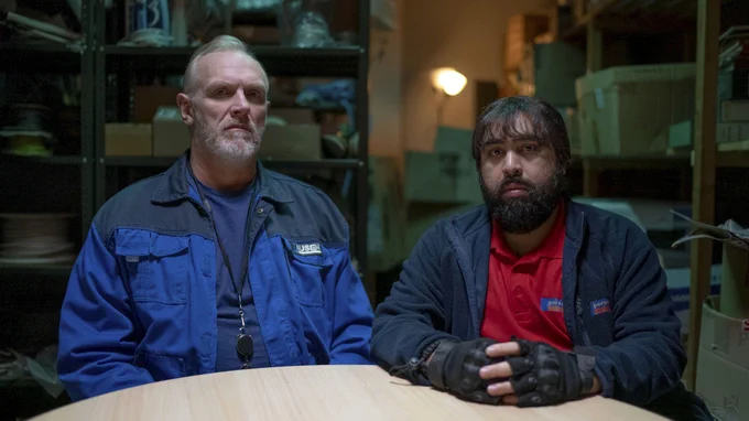 Paul 'Wicky' Wickstead (GREG DAVIES) and Karl (ASIM CHAUDHRY).