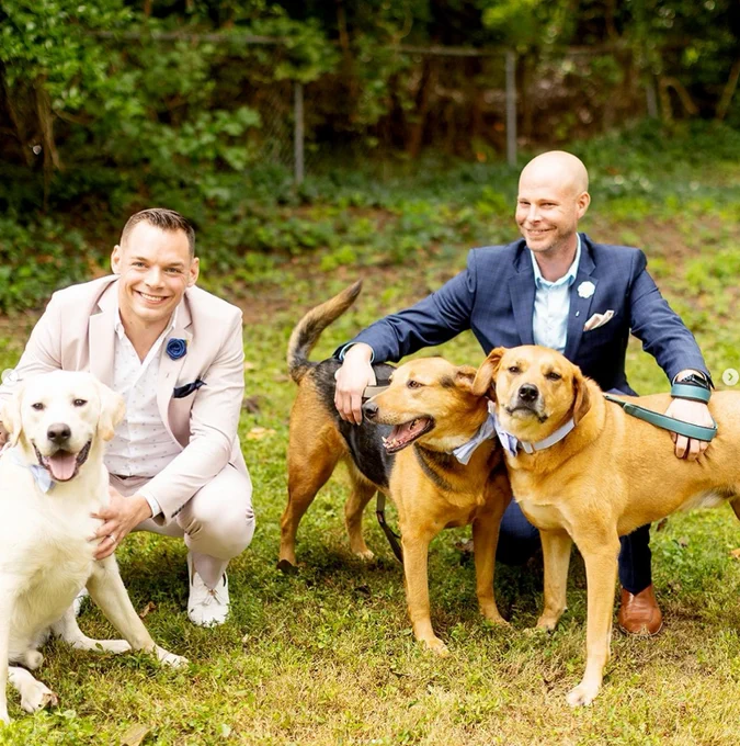 Image description: Brian S. - Lowe's Store Manager (Fairfax, VA) and his husband and three dogs. 
