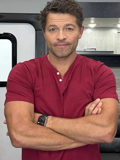 Me wearing a red shirt with my arms crossed.