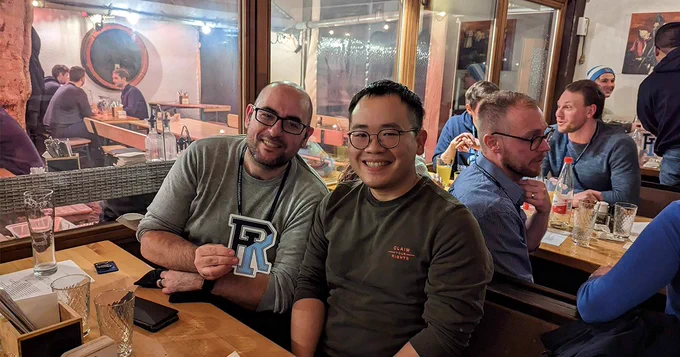 Two URI alumni at a meetup in Europe.