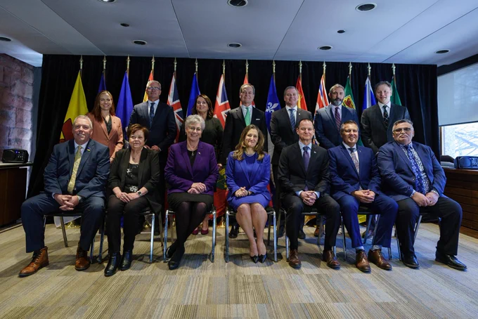 The Deputy Prime Minister, seated, attending the provincial and territorial Finance Ministers’ Meeting.