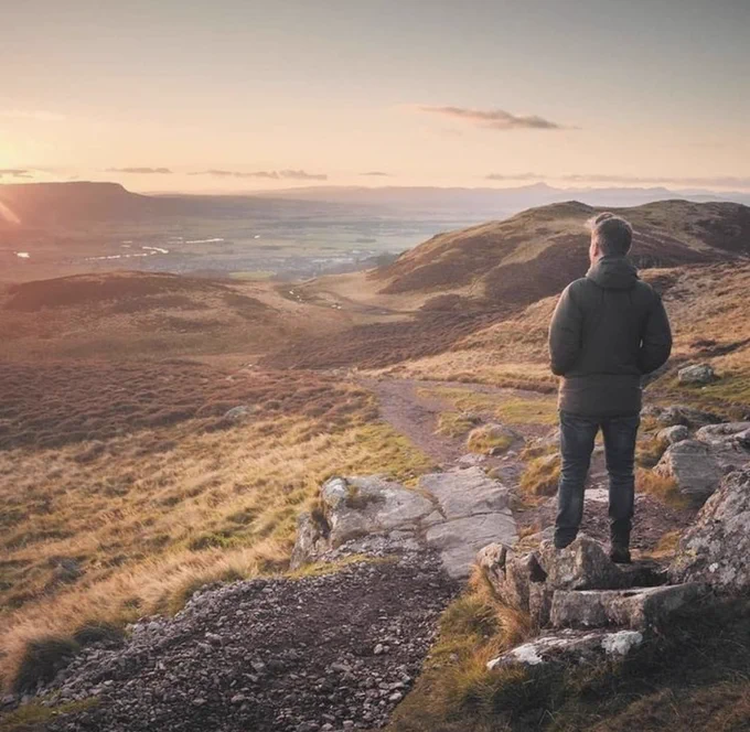 student up dumyat looking at the view of stirling/campus 