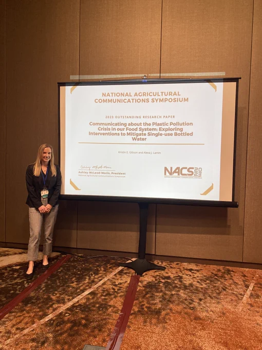 Kristin Gibson receiving the 2023 Outstanding Research Paper award at the National Agricultural Communications Symposium in Oklahoma City, OK.