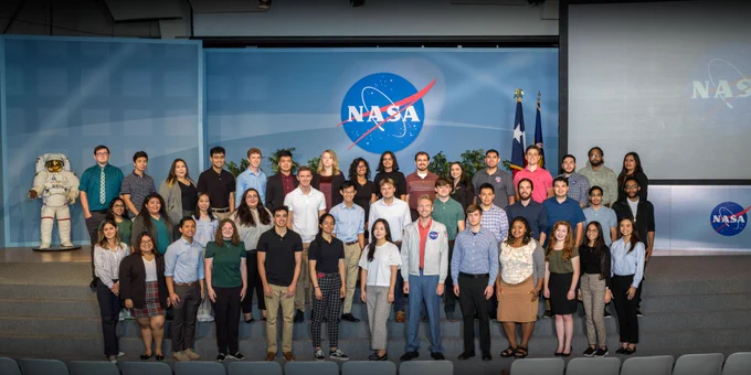 Group picture of all the Fall 2022 Interns from Johnson Space Center in Houston, Texas. The interns are of different races, genders, and ethnicities. Credit: NASA