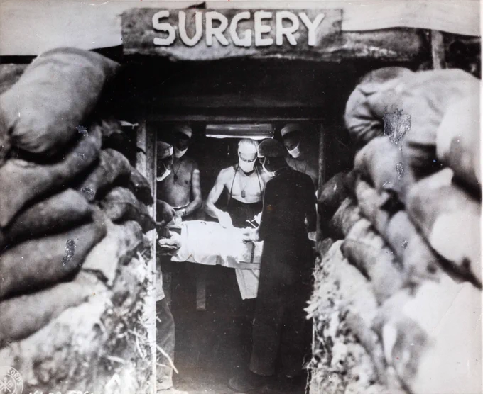 American Army surgeon operating on wounded soldier in underground surgery, Bougainville, Papua New Guinea, U.S. Army photograph, 1943