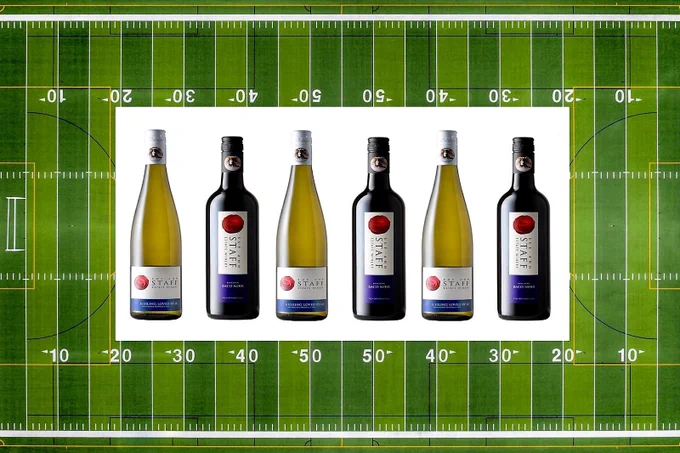 six bottles of wine superimposed over an American football field
