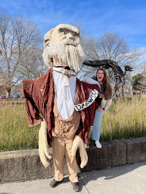 A 10 foot tall puppet of Charles Darwin and beside him is an EEB graduate student (Nicole).