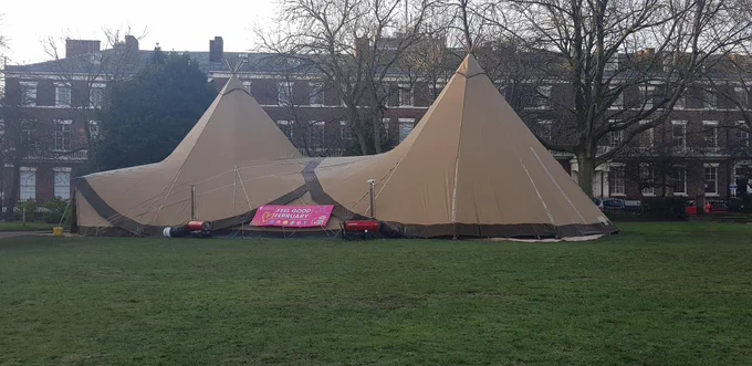 Photograph of cojoined teepees pitched on Abercromby Square - near the Sydney Jones Library. Call in for hot drinks & a lovely aura of calm. 