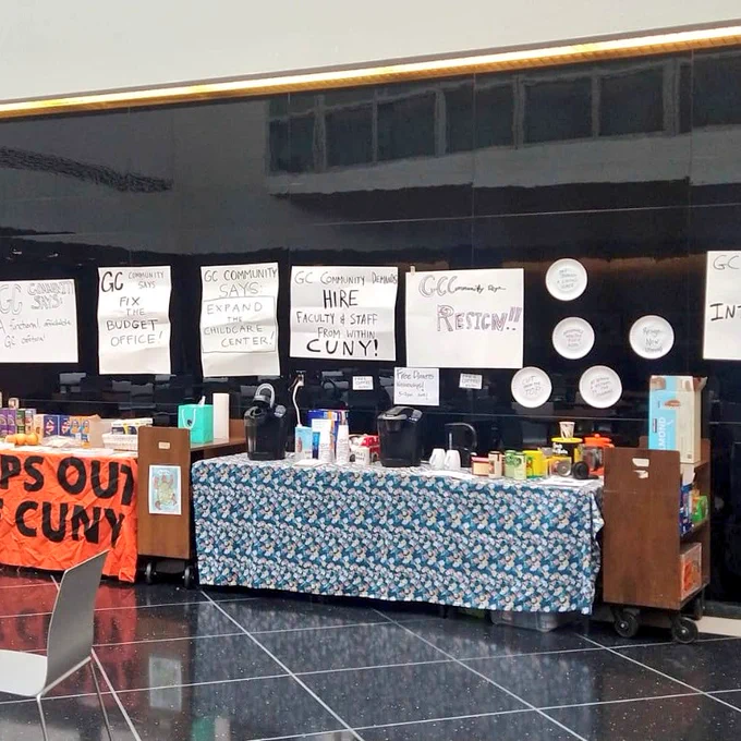 A picture of the pantry in the 8th floor dining Commons. There is food, coffe/tea, and political signs.