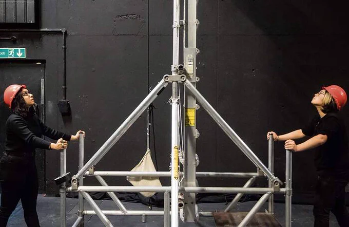 Two technicians working backstage