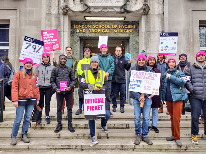 Strikers with placards outside the entrance of the LSHTM front entrance.