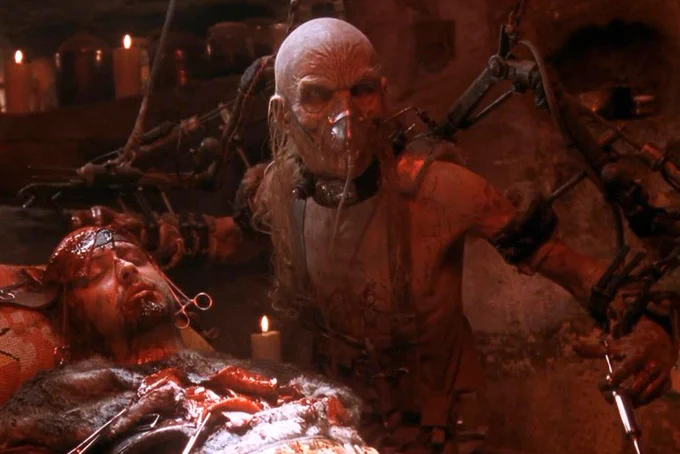House of 1000 Corpses Dr. Satan (Walter Phelan) with his medical equipment as he operates on Jerry (Chris Hardwick)
