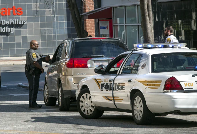 A VCU Police officer stops a motorist on campus.