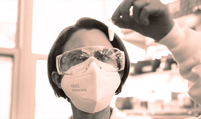 Kathryn Whitehead works with a test tube in her lab.