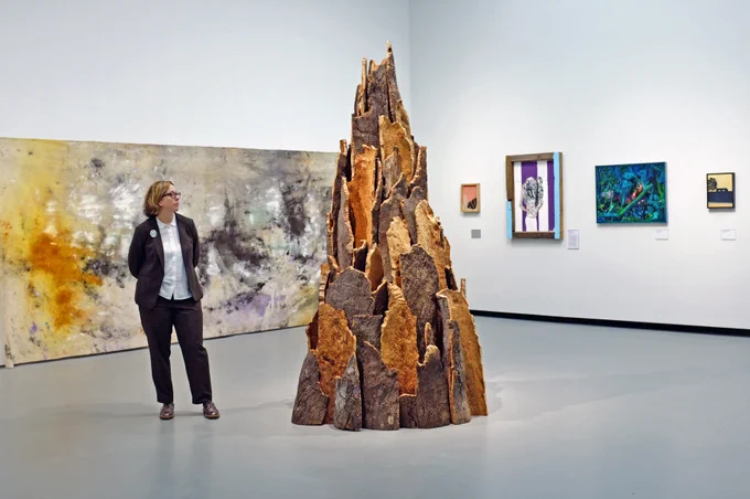 Head of Collections and Exhibitions, Sara Cooper, in front of Cork Spiral by David Nash. Photo by Will Barrett.
