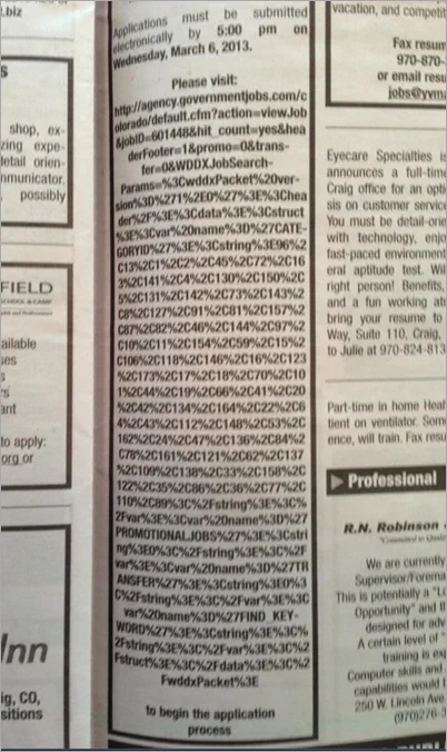 an incredibly long URL printed in a newspaper classified ad
