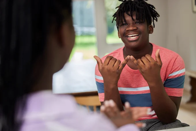Person having a conversation using sign language.