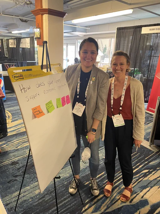 Picture of ALA President Lessa Kanani’opua Pelayo-Lozada and ALA staff member Megan Janicki on the JCLC exhibits floor