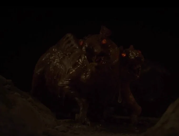 A two-headed Wererat from Willow (2022) with red eyes.