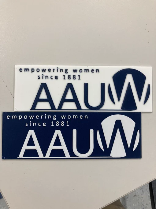 Two book bar bookmarks. Each with AAUW logo. One in white with blue letters, the other blue with white letters