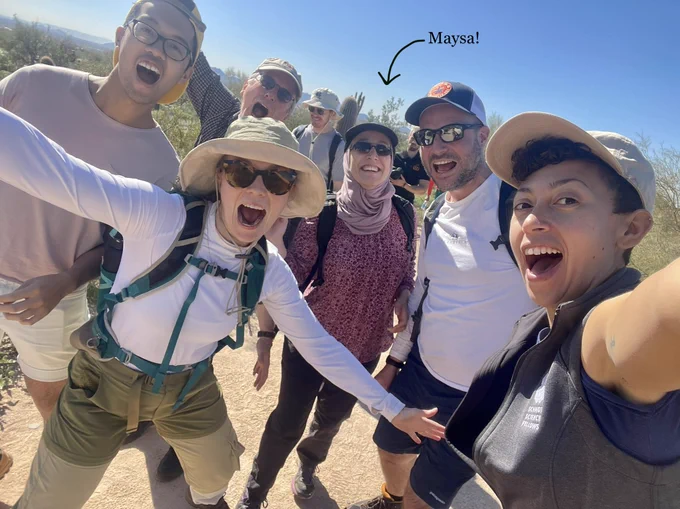 A group selfie of Schmidt Science Fellows and staff on a hike, including the excellent Maysa Mustafa in the middle.