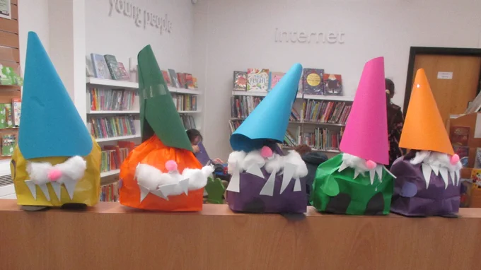 Gonks lined up on a shelf